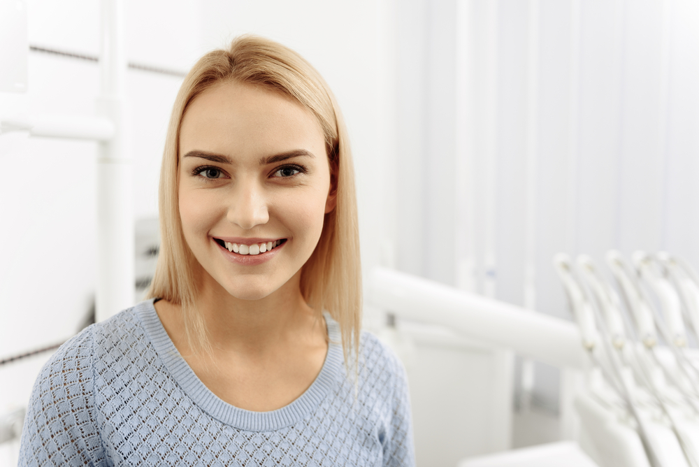 Pleasant patient smiling in dental office